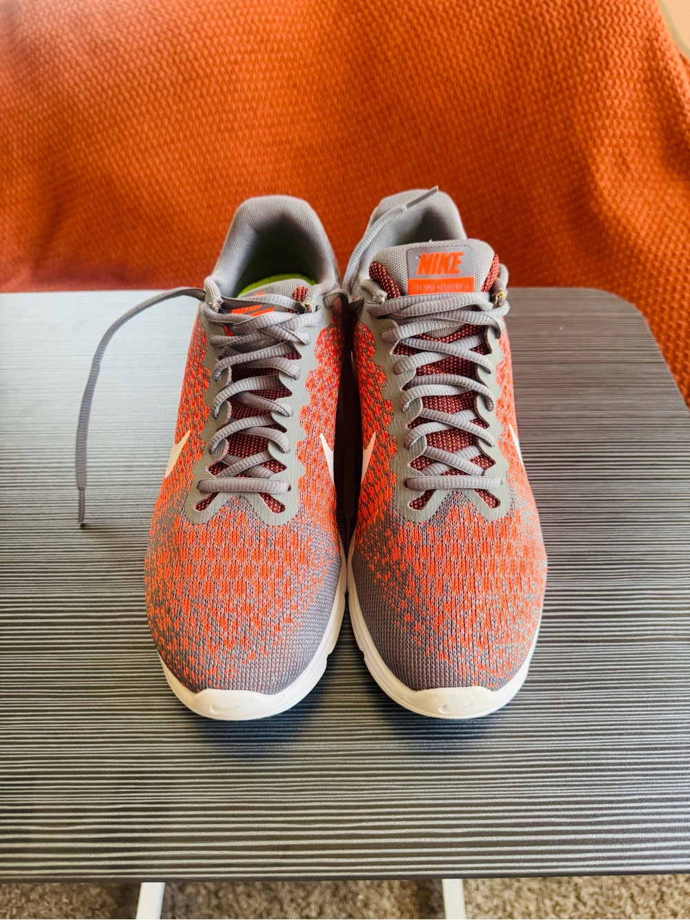 These are the women's Nike Air Max Sequent 2 running shoes in a grey and orange
